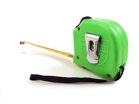 Green measuring tape rule on a white backgroundの写真素材