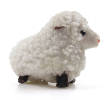 Small vintage wind-up toy sheep on whiteの写真素材