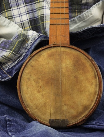 Simple old-time banjo on plaid-lined denimの写真素材