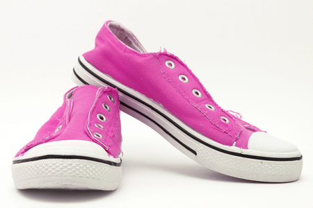 Brand new pair of hot pink sneakers on a white backgroundの写真素材