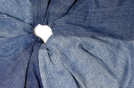 Assorted blue jeans fan out from a central pointの写真素材