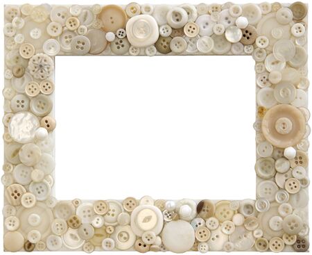 A picture frame cleverly adorned with various shades of white buttonsの写真素材