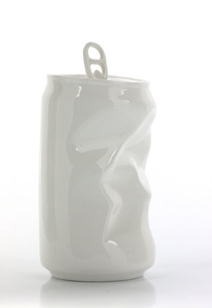 Crumpled beer can in white over white