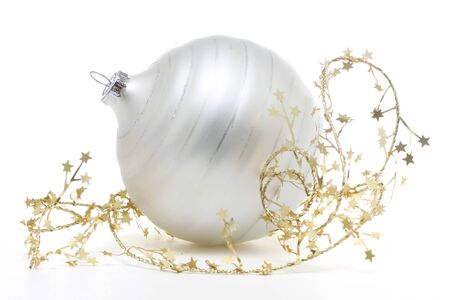 Beautiful white Christmas ornament with gold stars on a white backgroundの写真素材
