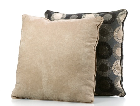 Two sofa pillows covered in neutral fabricsの写真素材
