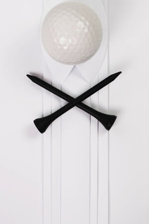 Golf ball with black tees on white pleatsの写真素材
