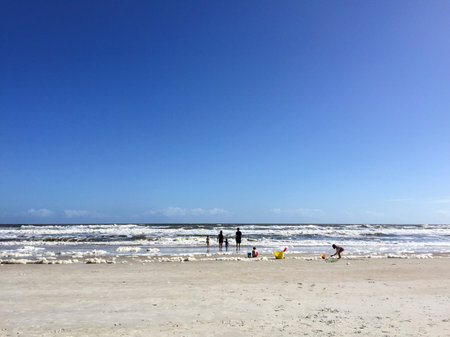 Distant Shot of Family On A Beachの写真素材