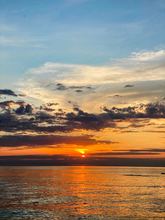 Dramatic Sunset Over Reflective Water