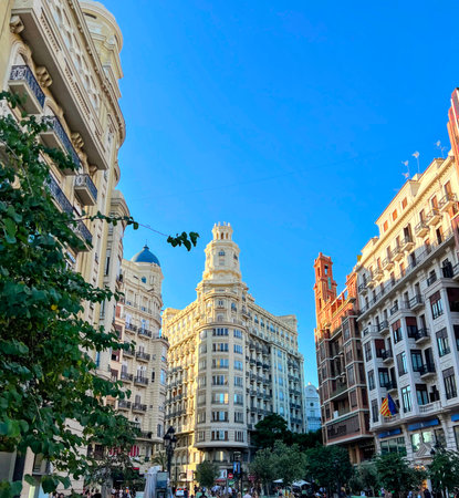 Plaza del Ayuntamiento Buildings at Sunsetの写真素材