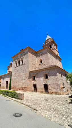 Historic Brick Building Under Clear Blue Skyの写真素材