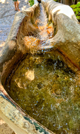 Water Flowing in Old Stone Channelの写真素材