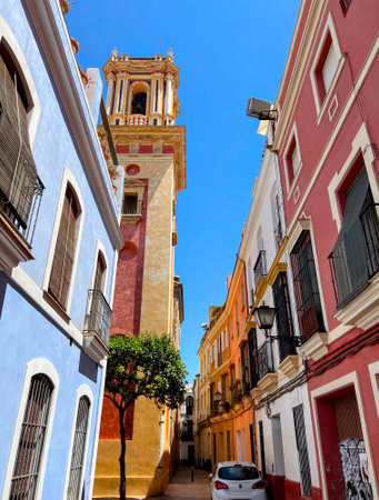 Colorful Seville Street with Bell Towerの写真素材