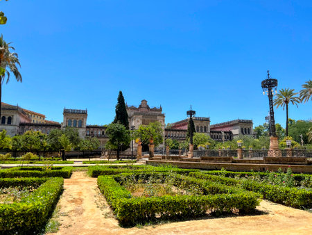 Seville Park with Ornate Buildings and Hedgesの写真素材