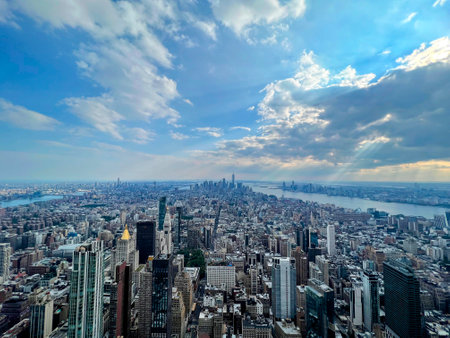 Manhattan Panorama with Rivers Under Cloudy Skyの写真素材