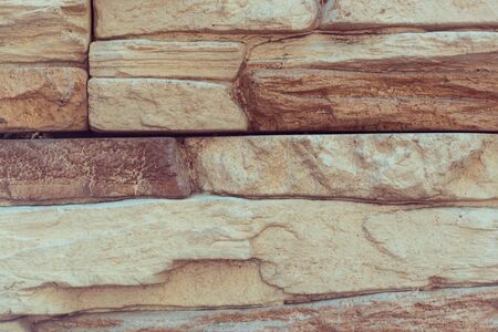 Closeup texture of rough weathered gray brick wall backgroundの写真素材