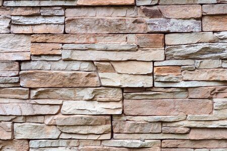 Closeup texture of rough weathered gray brick wall backgroundの写真素材