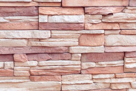 Closeup texture of rough weathered gray brick wall backgroundの写真素材