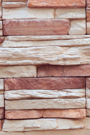 Closeup texture of rough weathered gray brick wall background