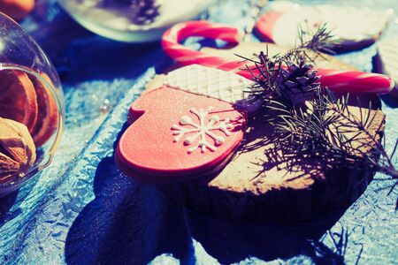 Gingerbread Santa Claus with sweets on table christmas composition backgroundの写真素材