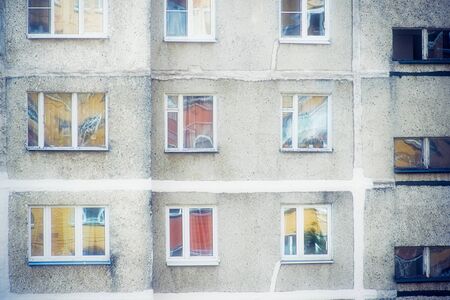 Gray facade of old multi-storey residential building from USSR times in Russiaの写真素材