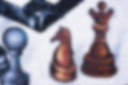 Artistic graffiti chess blurred elements on a grunge white brick wall backgroundの写真素材