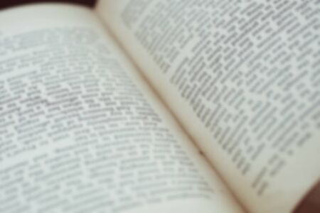 Opened old english book's pages blurred close-up backgroundの写真素材