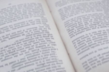 Opened old english book's pages blurred close-up backgroundの写真素材