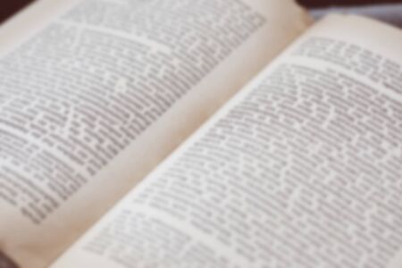 Opened old english book's pages blurred close-up backgroundの写真素材