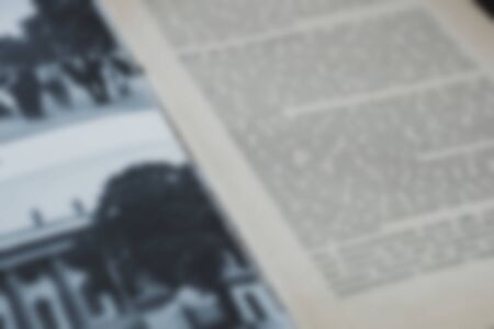 Opened old english book's pages blurred close-up backgroundの写真素材