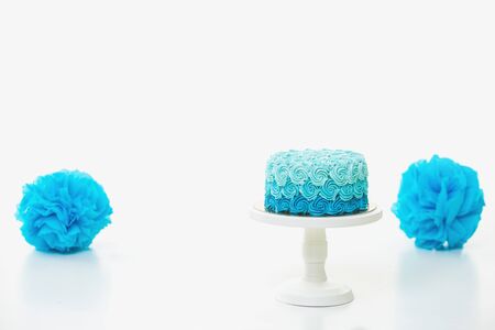 Blue cake and decoration on white backroundの写真素材
