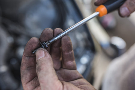 male dirty hand with screwdriver