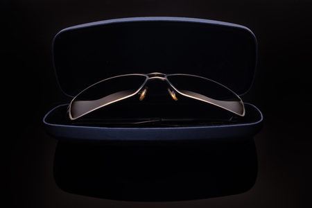 sunglasses on black reflective background soft focusの写真素材