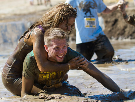 BOISE, IDAHO/USA - AUGUST 10: Unidentified couple horsing around in the mud pit near the finish at...