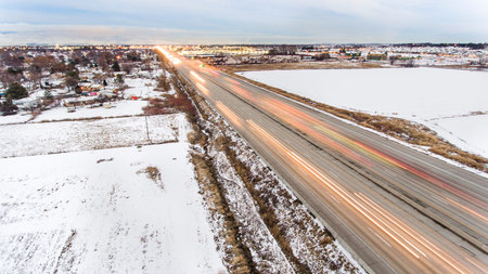 moving traffic on the freeway as shot from a drone