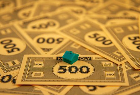 Debt from buying houses in the game of monopolyのeditorial素材