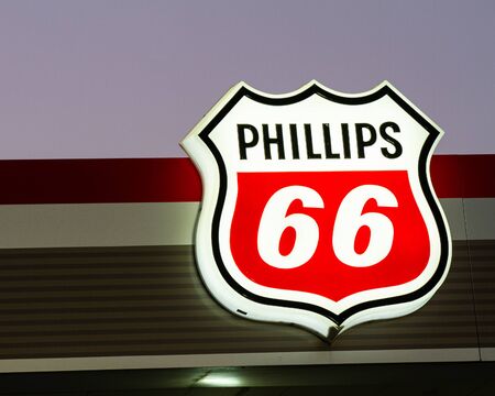 Lit up Phillips 66 gas station sign at nightのeditorial素材