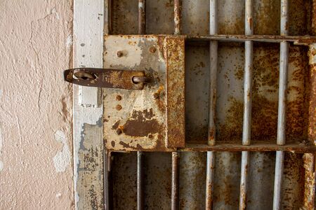 rusty jail or prison door with rusted barsの写真素材