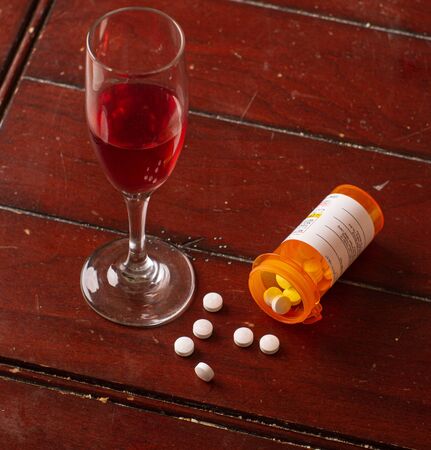 mixing pills and wine is not a good ideaの写真素材