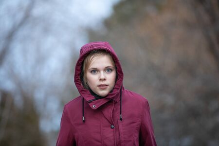 Preteen girl walking on a cold dayの写真素材