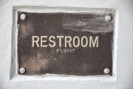 restroom sign that is oldの写真素材