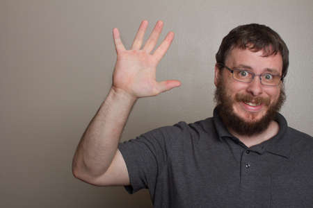Man waving goodbye to someoneの写真素材