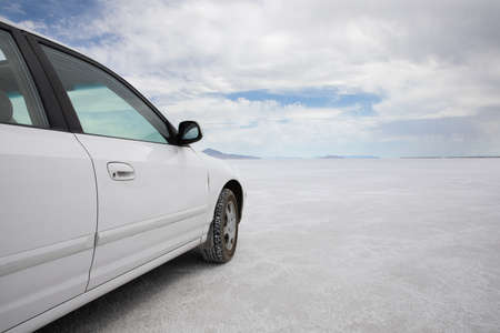 clouds in the backgroudn while driving on a white surfaceの写真素材