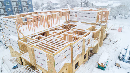 new apartment building being constructed in winter