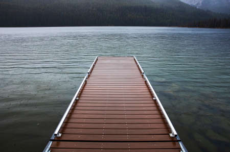 dock leading out of the lakeの写真素材