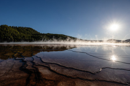 A large body of water with steam rising from itの写真素材