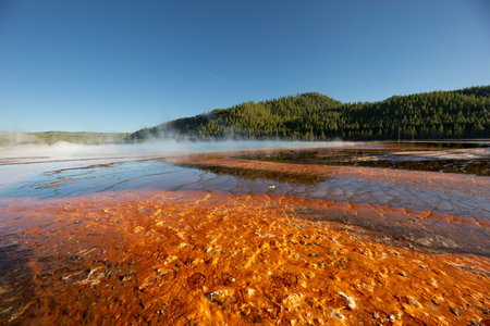 A large body of water with steam rising from itの写真素材