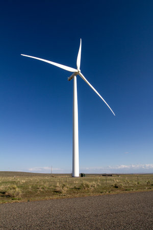 A large wind turbine is standing in a fieldの写真素材