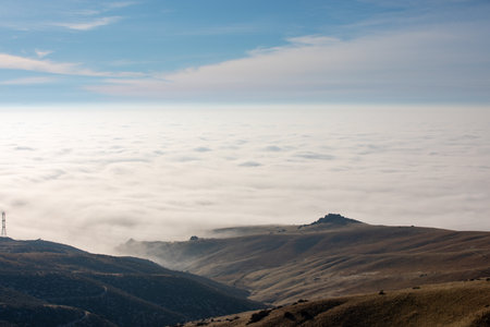 The sky is cloudy and the sun is barely visibleの写真素材