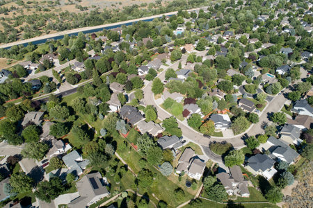 A residential area with houses and treesの写真素材