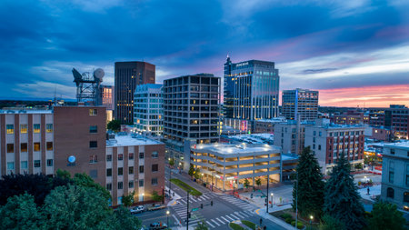 A city skyline at dusk with a large building in the middleの写真素材